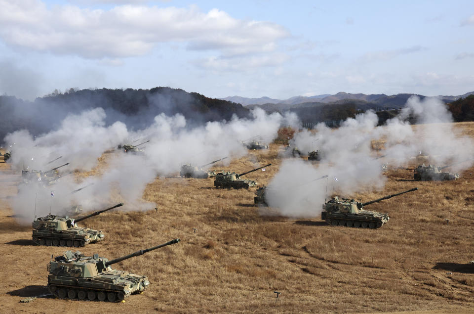 South Korean army K-9 self-propelled howitzers and K-55A1 self-propelled howitzers fire during the military drills at a training field in Cheorwon, South Korea, Friday, Oct. 27, 2023. (Yang Ji-woong/Yonhap via AP)