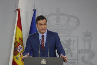 Spain's Prime Minister Pedro Sanchez addresses the media at the Moncloa Palace in Madrid, Spain, Sunday, Jan. 12, 2020. Sanchez was chosen by Parliament as prime minister on Tuesday, ending a period in which he led a caretaker Socialist government following two inconclusive elections last year.(AP Photo/Manu Fernandez)