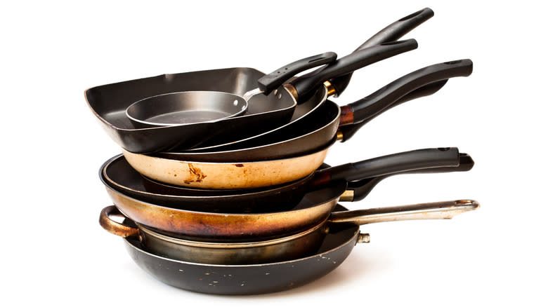 Unused cooking pans stacked 