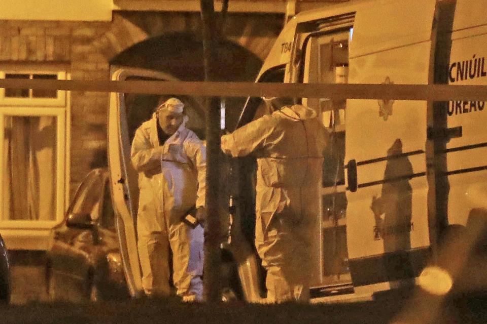 Garda at a house in the village of Newcastle, south west of Dublin city where three children have been found dead. (PA Wire/PA Images)