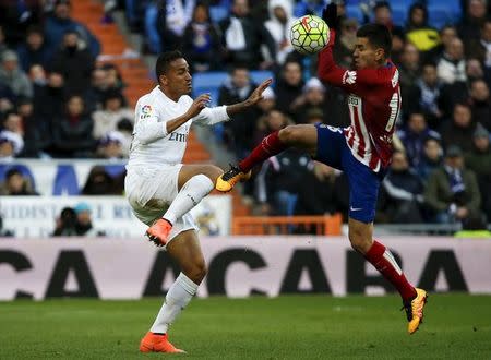 Football Soccer - Real Madrid v Atletico Madrid - Spanish Liga BBVA - Santiago Bernabeu stadium, Madrid, Spain - 27/2/16 Atletico Madrid's Angel Correa and Real Madrid's Danilo in action. REUTERS/Sergio Perez