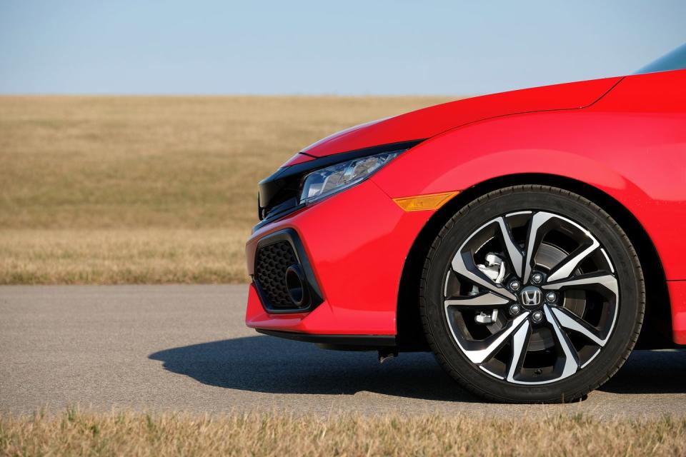 <p>The Si’s 18-inch wheels can be wrapped in all-season tires or summer rubber in the same 235/40R-18 size. Obviously, we’d spring for the summer tires, which in the Civic’s case are sticky Goodyear Eagle F1 Asymmetric 2s. Wearing those shoes, the Civic Si was capable of 0.97 g of grip on our skidpad, which is an astounding performance for an affordable front-drive compact car.</p>