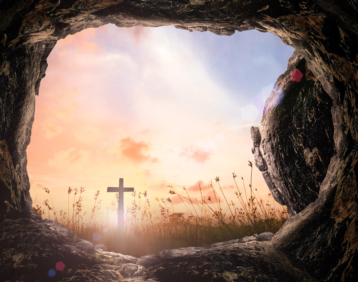 An empty tomb with a cross at sunrise. (Photo: Getty Images)