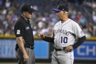 Colorado Rockies manager Bud Black (10) talks to umpire Dan Bellino after an interference was called on Charlie Blackmon during the third inning of the team's baseball game against the Arizona Diamondbacks, Saturday, Aug. 6, 2022, in Phoenix. (AP Photo/Rick Scuteri)