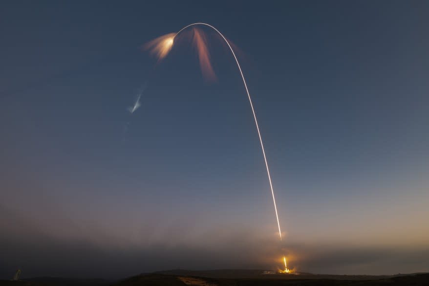 Falcon 9 rocket launching from pad 4E at Vandenberg Space Force Base, carrying 22 new Starlink satellites into space.