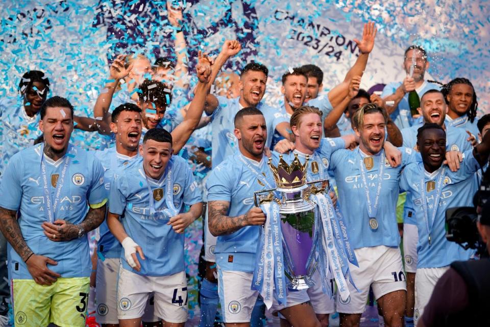 Man City celebrate a fourth title in a row (AP)
