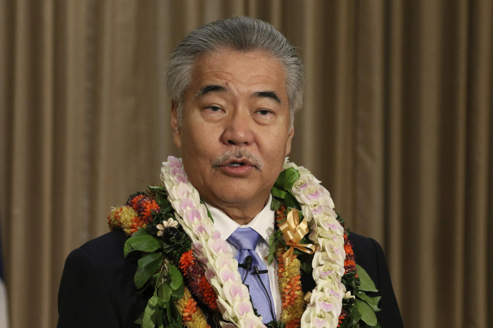 FILE - In this Jan. 21, 2020, file photo, Gov. David Ige speaks to reporters in Honolulu after delivering his state of the state address at the Hawaii State Capitol. While governors across the country are ending all or most of their coronavirus restrictions, many of them are keeping their pandemic emergency orders in place. Those orders allow them to restrict public gatherings and businesses, mandate masks, sidestep normal purchasing rules, tap into federal money and deploy National Guard troops to administer vaccines. (AP Photo/Audrey McAvoy, File)