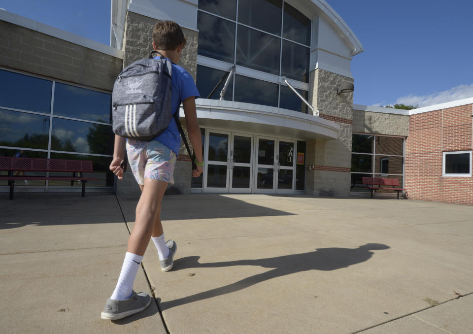 Braylon Price, 13, on his way home from Bellefonte Middle School Wednesday, Aug. 31, 2022, in Bellefonte, Pa. Braylon was among more than 45,000 Pennsylvania students whose parents elected to take advantage of a new state pandemic-era law option of holding their child back a year in school. Braylon repeated the sixth grade. (AP Photo/Gary M. Baranec)