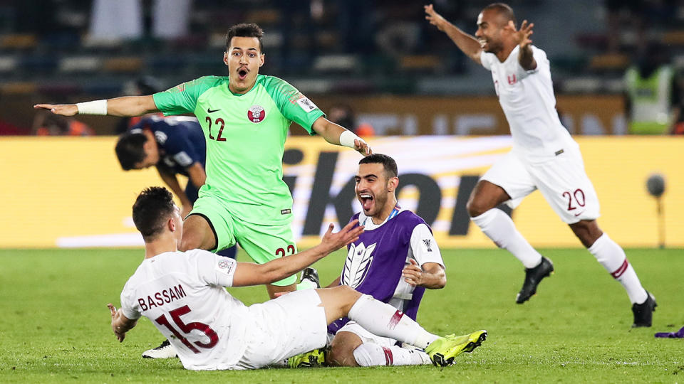 Bassam Alrawi and Mohammed Ahmed Albakri celebrate. (Photo by Zhizhao Wu/Getty Images)