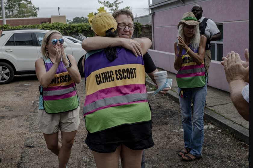 Members of Clinic Escort welcome dr.Cheryl Hamlin, one of the doctors coming to perform abortions in the clinic as she arrives at the last day of legal procedures in Mississippi. Jackson, Mississippi on 06.07.2022