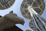 Energy trees are seen next to a camel sculpture at Terra, The Sustainability Pavilion during a media tour at the Dubai World Expo site in Dubai, United Arab Emirates, Saturday, Jan. 16, 2021. With the inauguration of Expo 2020 Dubai, the next world's fair, nine months away amid the raging global pandemic that forced its postponement, organizers unveiled the site's signature pavilion to reporters for the first time on Saturday. (AP Photo/Kamran Jebreili)