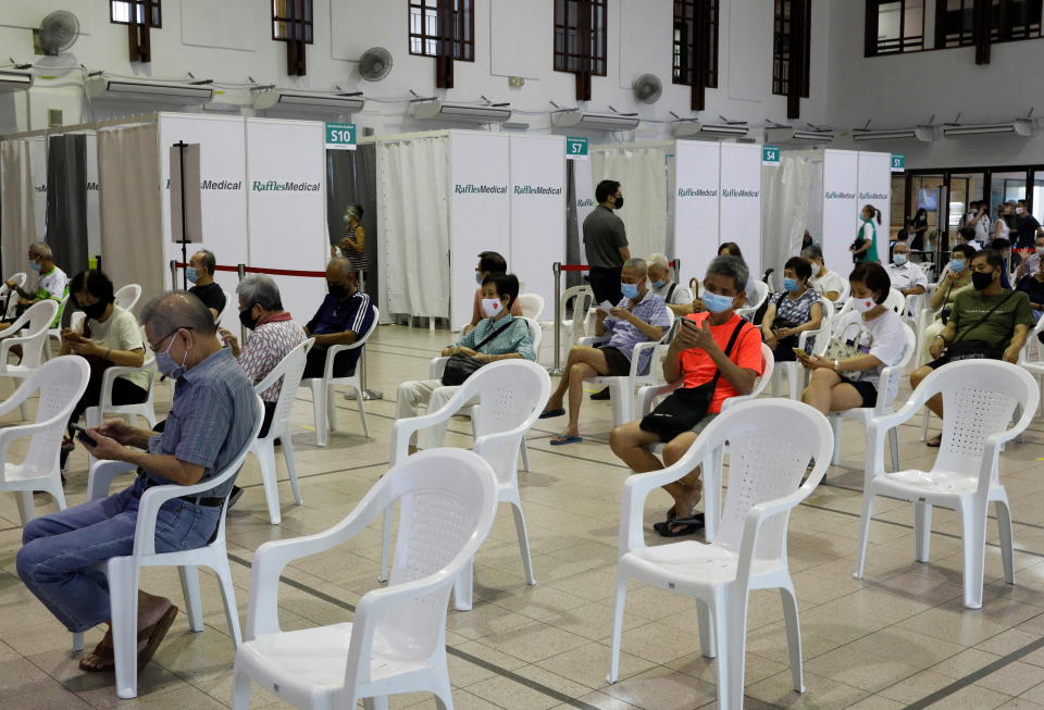 Seniors waiting in an observation area after getting a dose of the COVID-19 vaccine at a vaccination centre in Singapore.