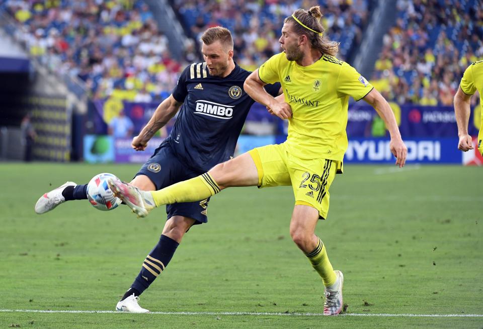 July 3: Philadelphia Union forward Kacper Przybylko (23) shoots the ball against Nashville SC defender Walker Zimmerman (25) during the first half at Nissan Stadium. Nashville won the game, 1-0.