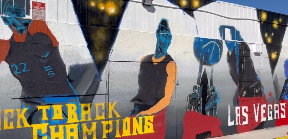 Team of seven local artists painting a mural in Downtown Las Vegas in celebration of the Las Vegas Aces back-to-back WNBA Championship win (KLAS/ Greg Haas)