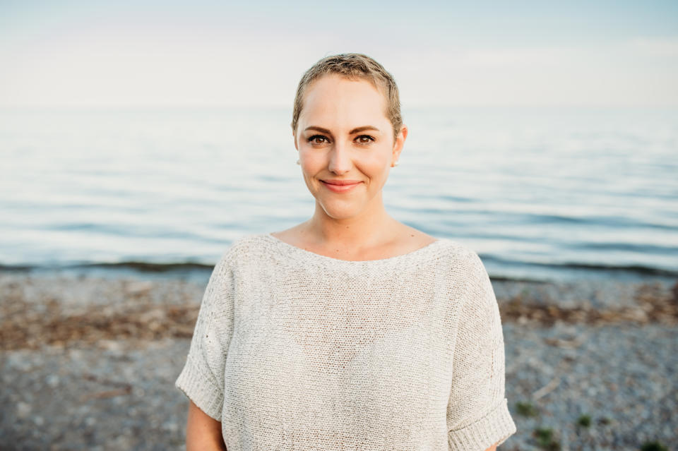 Robyn Goldman of Ajax, Ont., who was diagnosed with breast cancer at age 33, stands in front of a shore. (Photo provided by Robyn Goldman)