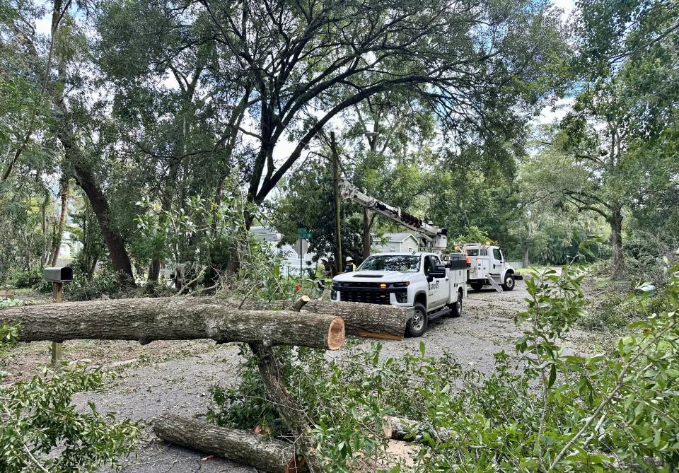 Repair crews steady a power pole in Live Oak on Aug. 31. 2023, a day after Hurricane Idalia made landfall near Keaton Beach, located roughly 78 miles away. The hurricane knocked out power to most residents in Suwannee County