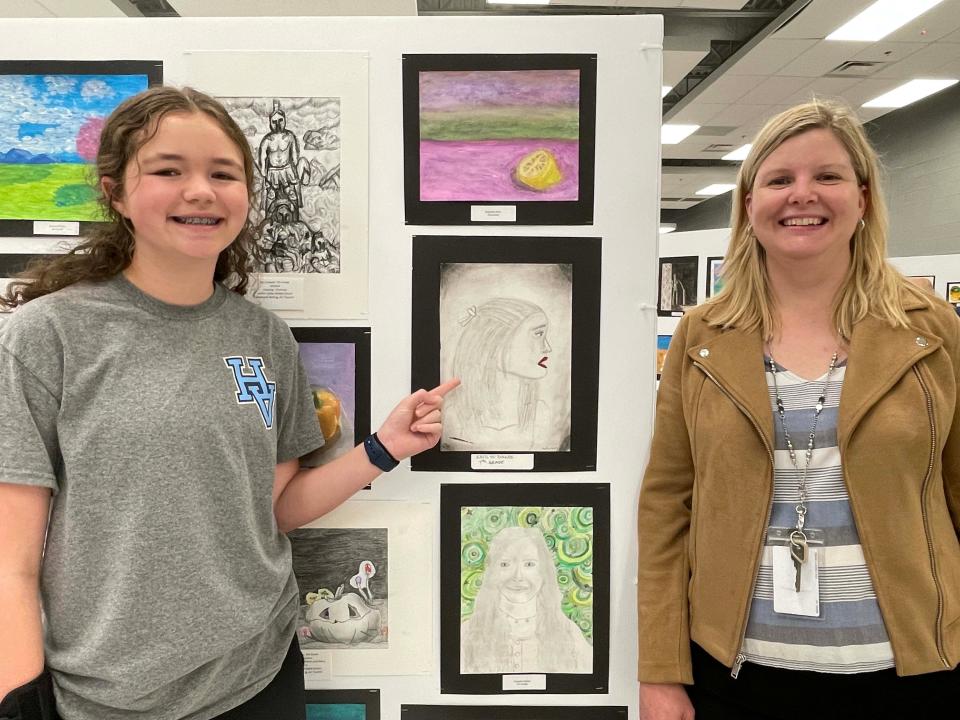 Seventh-grader Kaitlyn Parker worked hard to get the proportions of her self-portrait just right with the help of art teacher Robyn Marshall at the annual Fine Arts Night held at Hardin Valley Middle School Tuesday, April 12, 2022.