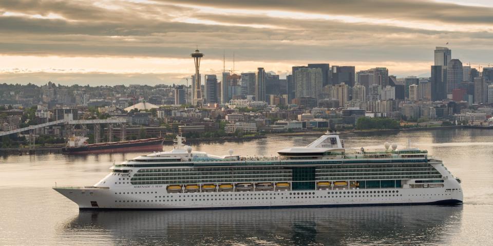 the Serenade of the Seas in the water with the Seattle skyline in the back