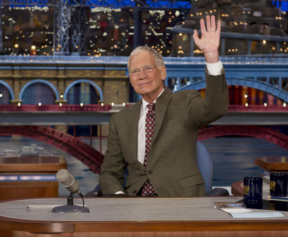 In this Thursday, April 3, 2014 photo provided by CBS, David Letterman, host of the “Late Show with David Letterman,” waves to the audience in New York, after announcing that he will retire sometime in 2015. (AP Photo/CBS, Jeffrey R. Staab) MANDATORY CREDIT, NO SALES, NO ARCHIVE, FOR NORTH AMERICAN USE ONLY