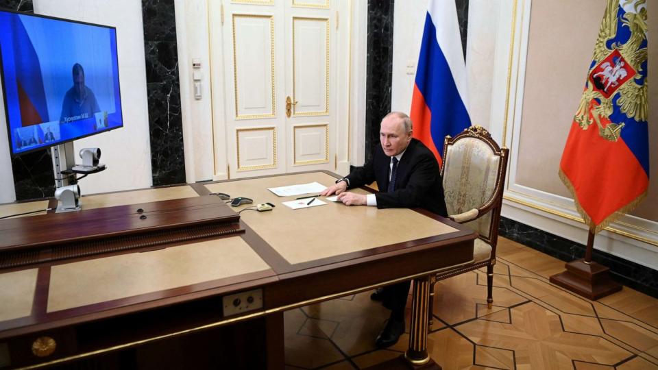 PHOTO: Russian President Vladimir Putin attends a televised meeting with officials to assess the consequences of an attack on the Crimean Bridge in Moscow, July 17, 2023. (Sputnik/Alexander Kazakov/Kremlin via Reuters)
