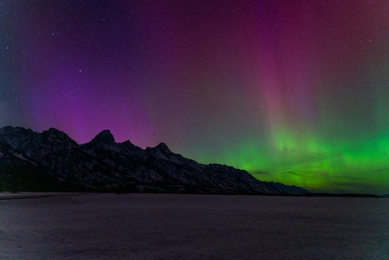 The Northern Lights dance above the Tetons.