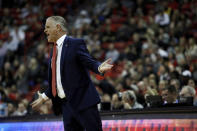 San Diego State Head Coach Brian Dutcher talks to players during the first half of an NCAA college basketball game on Sunday, Dec. 26, 2020, in Las Vegas. (AP Photo/Joe Buglewicz)