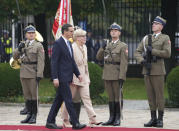 Lithuanian Prime Minister Ingrida Simonyte, centre, being greeted by Poland's Prime Minister Mateusz Morawiecki on a visit for talks that include the region's security in the face of migrant pressure on the two countries' borders with Belarus, in Warsaw, Poland, on Friday, Sept. 17, 2021. (AP Photo/Czarek Sokolowski)