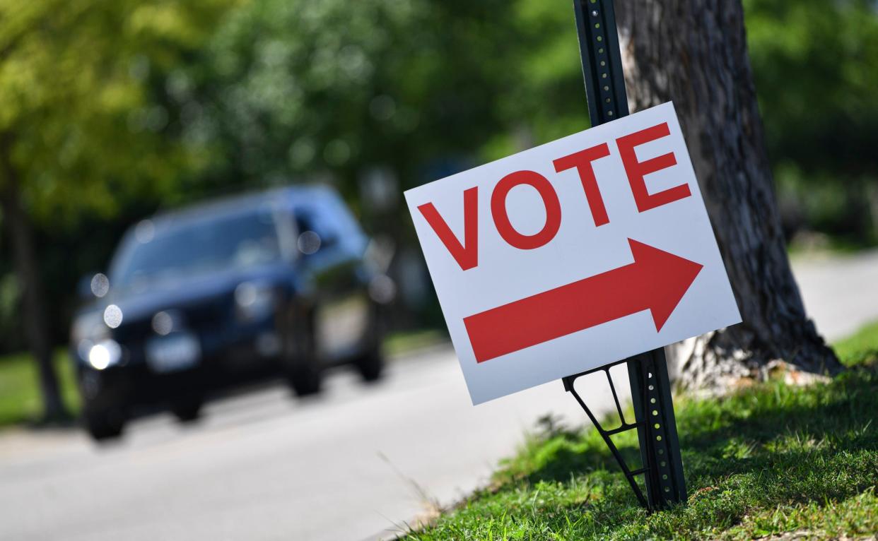 A sign directs voters to the St. Cloud City Hall polling place for primary elections Tuesday, Aug. 9, 2022, along Seventh Street South in St. Cloud.  