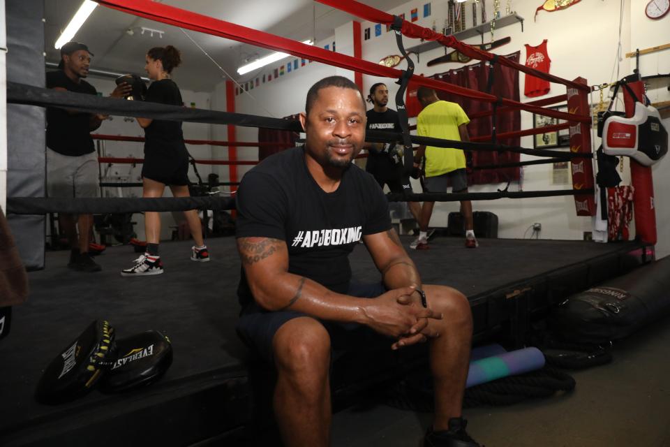 APJ Boxing Club owner Kariym Patterson takes a quick break on the boxing ring while in the gym in Poughkeepsie on July 7, 2021.