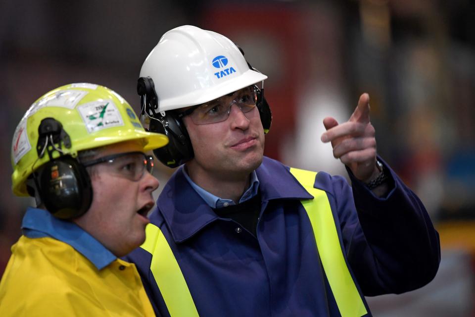 Britain's Prince William, Duke of Cambridge (R) wears a hard hat and protective clothes as he speaks with Works Manager Carl Banfield during his visit to the Tata Steel plant in Port Talbot, south Wales on February 4, 2020. (Photo by TOBY MELVILLE / POOL / AFP) (Photo by TOBY MELVILLE/POOL/AFP via Getty Images)