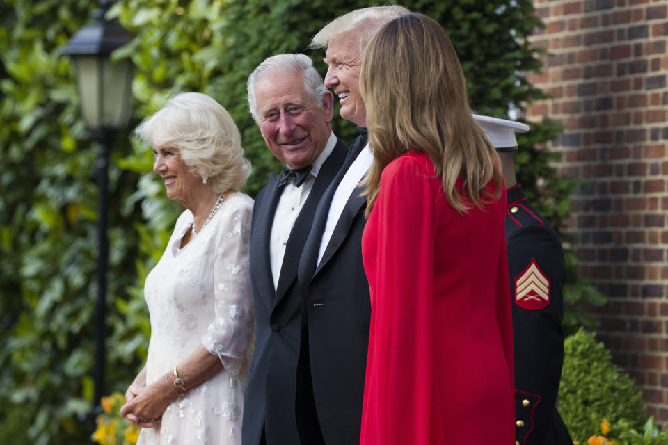 President Donald Trump and first lady Melania Trump pose for a photograph with Prince Charles, and Camilla, Duchess of Cornwall, before a dinner at the U.S. ambassador's residence, Tuesday, June 4, 2019, in central London. (AP Photo/Alex Brandon)