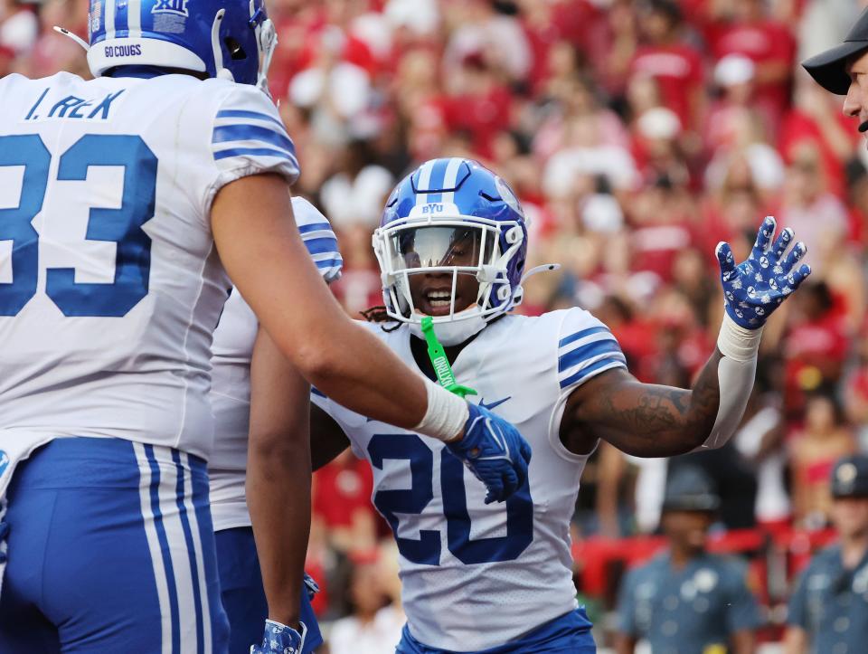 Brigham Young Cougars running back Deion Smith (20) celebrates his touchdown against the Arkansas Razorbacks at Razorback Stadium in Fayetteville on Saturday, Sept. 16, 2023. | Jeffrey D. Allred, Deseret News