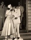 <div class="caption-credit"> Photo by: www.loc.gov</div><div class="caption-title">1948 - Dezi Arnaz & Lucille Ball</div>By the end of the 40s, the return of proper, dignified weddings is en vogue. Take, for example, Lucille Ball's gown. Lucy and Desi originally eloped in 1940 but nine years later had a Catholic church wedding. Desi wore a white suit and Lucy wore a blue satin wedding dress.