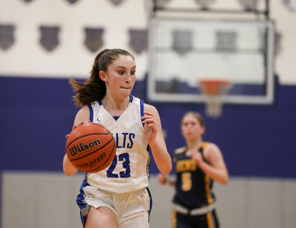 McNary's Avery Buss (23) drives down the court during the game against Bend on Friday, Jan. 21, 2022 at McNary High School in Keizer, Ore. 