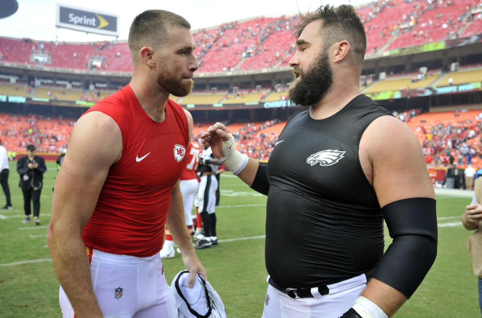 FILE - Kansas City Chiefs tight end Travis Kelce, left, talks to his brother, Philadelphia Eagles center Jason Kelce, after they exchanged jerseys following an NFL football game in Kansas City, Mo., Sept. 17, 2017. Eagles center Jason Kelce has told teammates he intends to retire after 13 NFL seasons, according to three people informed of the decision. They spoke to the AP on condition of anonymity Tuesday, Jan. 16, 2024, out of respect for Kelce's decision, which has not yet been made public. (AP Photo/Ed Zurga, file)