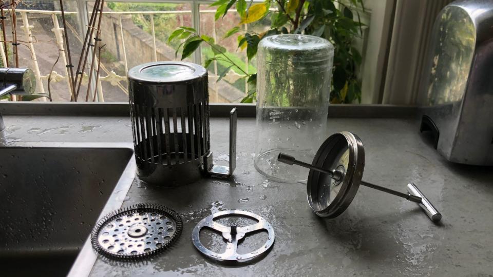 The separate parts of the french press drying