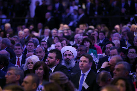 Guests listen as U.S. President Donald Trump delivers a speech during during the National Prayer Breakfast event in Washington, U.S., February 2, 2017. REUTERS/Carlos Barria