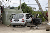 In this Sunday, April 7, 2019, photo, a man prepares to drive his car in Nuku'alofa, Tonga. China is pouring billions of dollars in aid and low-interest loans into the South Pacific, and even in the far-flung kingdom of Tonga there are signs that a battle for power and influence among much larger nations is heating up and could exact a toll. (AP Photo/Mark Baker)