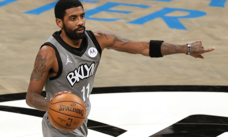 Kyrie Irving dribbling for the Nets.