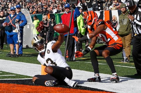 New Orleans Saints wide receiver Michael Thomas (13) reacts after scoring a touchdown against the Cincinnati Bengals in the first quarter at Paul Brown Stadium - Credit: David Kohl/USA Today
