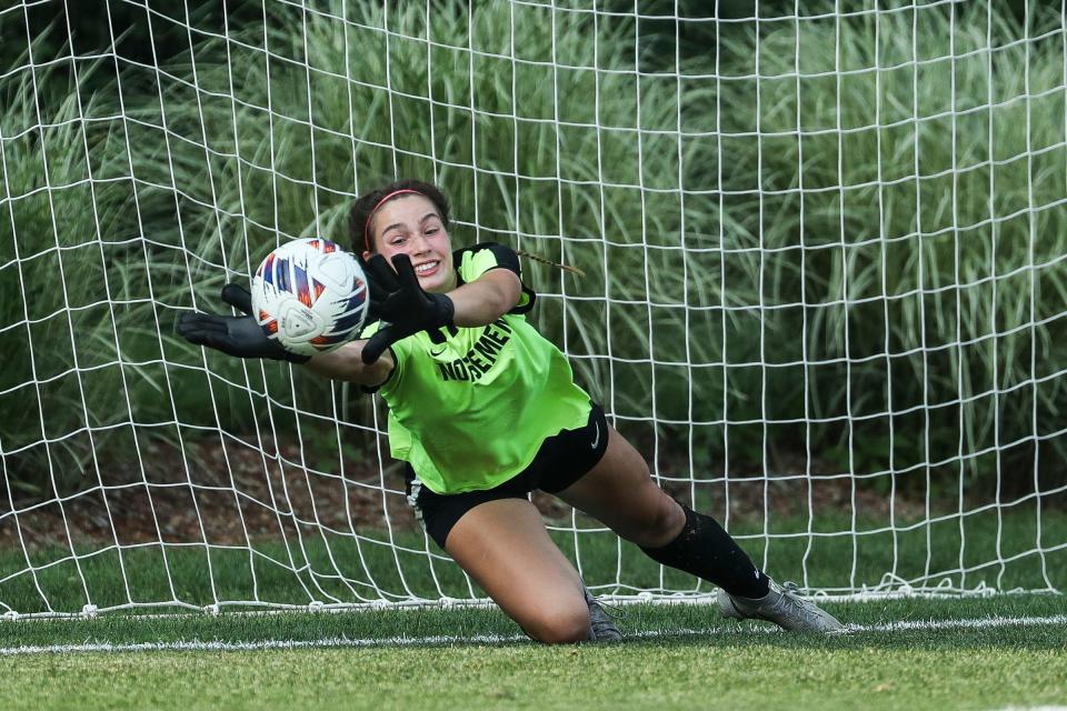 Grosse Pointe North goalkeeper Grace McCormick (1) makes a save in the shoot-out against East Grand Rapids during MHSAA Division 2 girls soccer state final at DeMartin Soccer Complex in East Lansing on Friday, June 16, 2023.