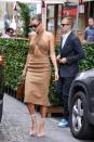 <p>For lunch with her husband, Hailey Bieber stepped into a LaQuan Smith midi dress that came complete with an ab-revealing cut-out. She paired the camel midi with a Little Liffner bag.</p>