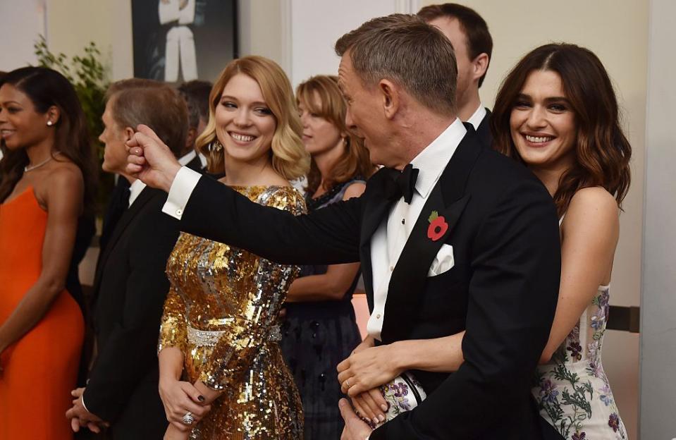 daniel craig and rachel weisz stand with cast members before the world premiere of the new james bond film spectre