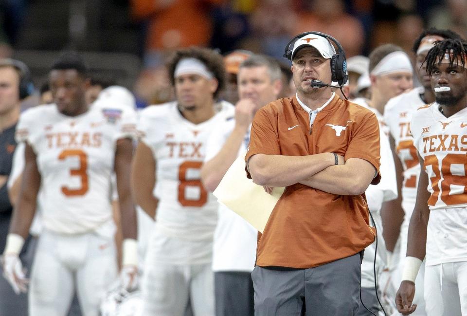 Texas head coach Tom Herman watches a replay against Georgia during the Sugar Bowl NCAA college football game on Tuesday, Jan. 1, 2019, in New Orleans, Louisiana.