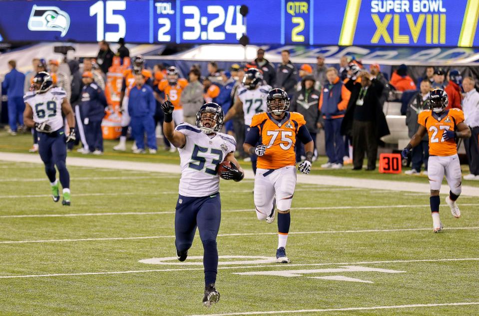 In this Feb. 2, 2014, file photo, Seattle Seahawks outside linebacker Malcolm Smith (53) reacts as he returns an interception for a touchdown against the Denver Broncos during the first half of the NFL Super Bowl XLVIII football game in East Rutherford, N.J.