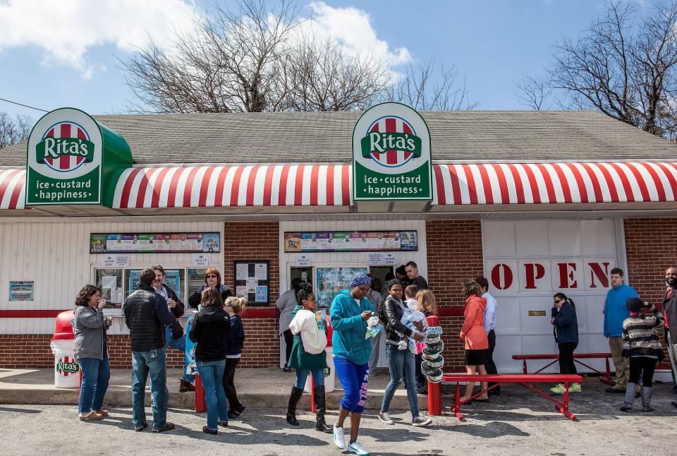 The traditional water ice giveaway at Rita's Italian Ice draws a crowd on the first day of spring each year.
.