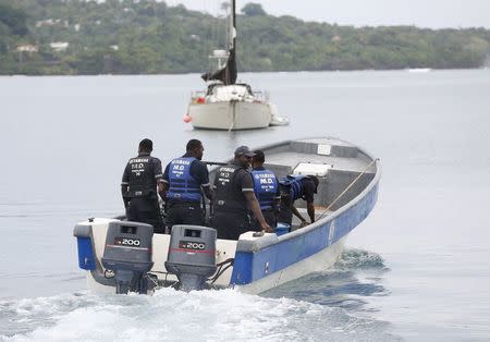 Members of Jamaica's Marine Police leave the port to join in the search for a small U.S. private plane with an unresponsive pilot that crashed off the east coast of Jamaica, in Port Antonio September 6, 2014. REUTERS/Gilbert Bellamy