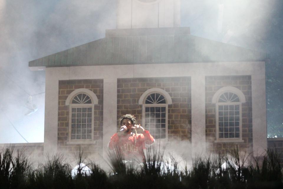 J. Cole performs in front of a replica of Fayetteville's Market House during the second day of his Dreamville Festival on Sunday, April 7, 2024, at Dorothea Dix Park in Raleigh, North Carolina.