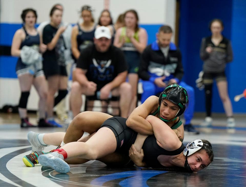 Flagler Palm Coast's Christina Borgmann locks in a hold on Matanzas' Arielle Yantin during the District 3-1A Tournament at Matanzas High School, Wednesday, Feb. 7, 2024.