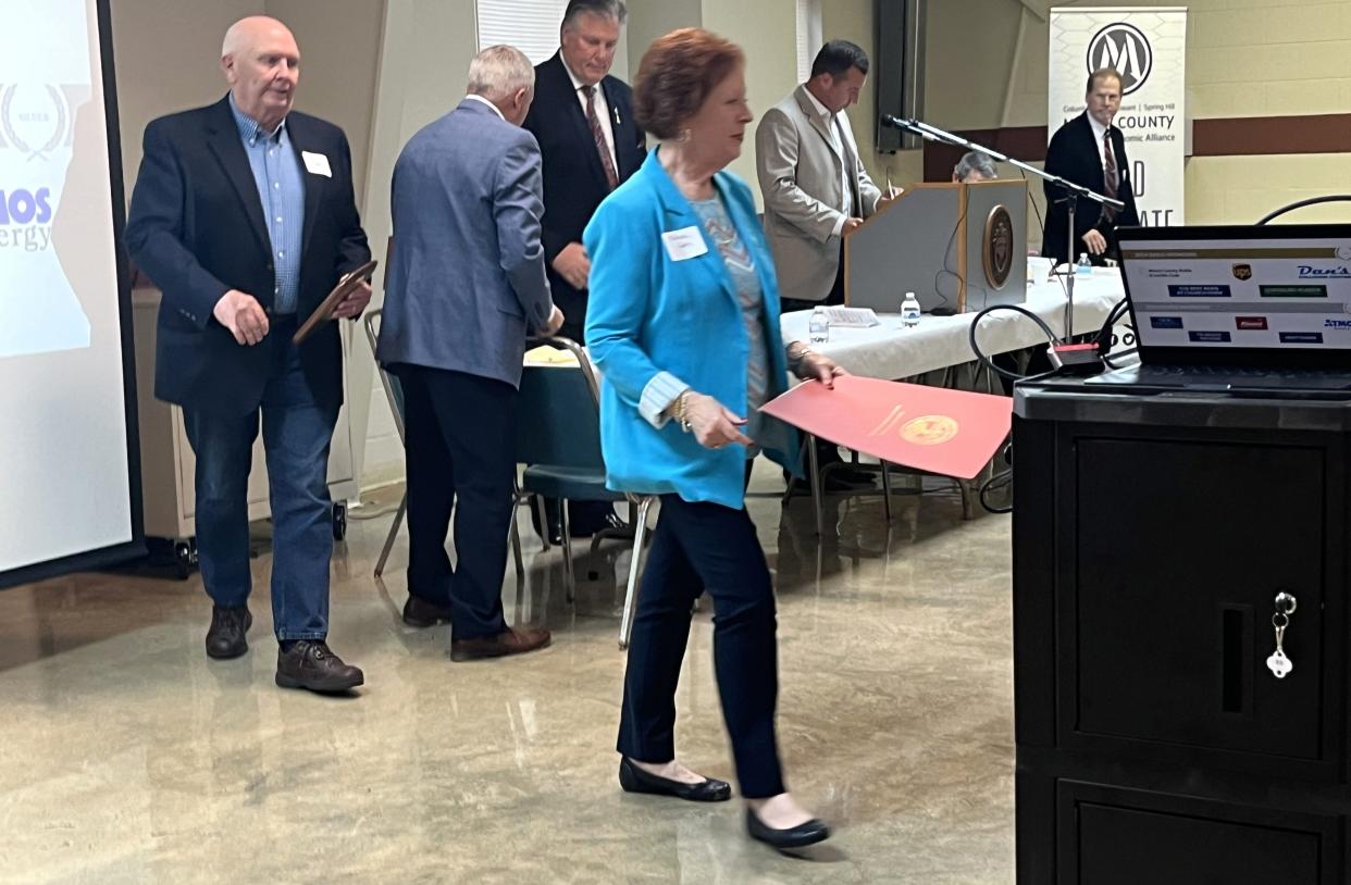Melissa Potts carries the Tennessee General Assembly proclamation declaring the Biffle Potts Farm in Hampshire, Tenn. as the Maury County Century Farm of the Year at the annual Farm Breakfast at the Ridley 4-H Center hosted by Maury Alliance on Friday, April 26, 2024.